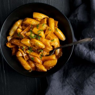 korean rice cakes in an orange sauce