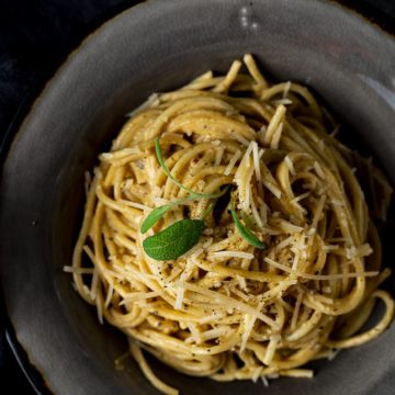 pasta in a bowl garnished with sage