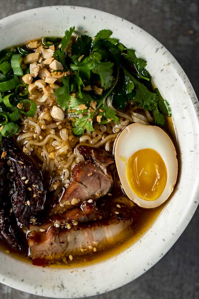 pork, egg and noodles in a bowl with broth