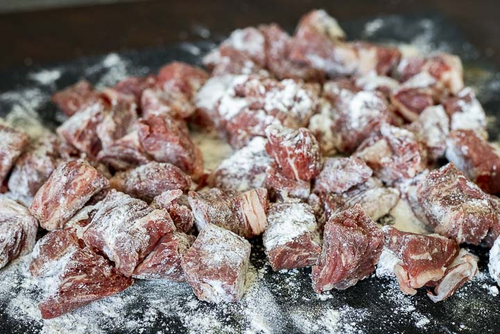 raw beef cubes coated in flour