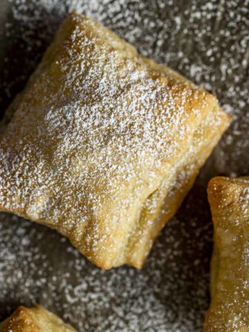 baked puff pastry square sprinkled with powdered augar