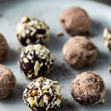 chocolate truffle rolled in nuts on a plate