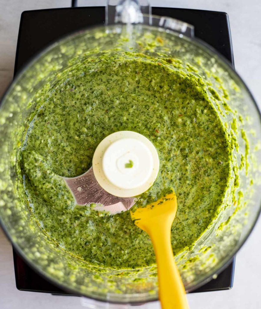 green sauce in a food processor bowl
