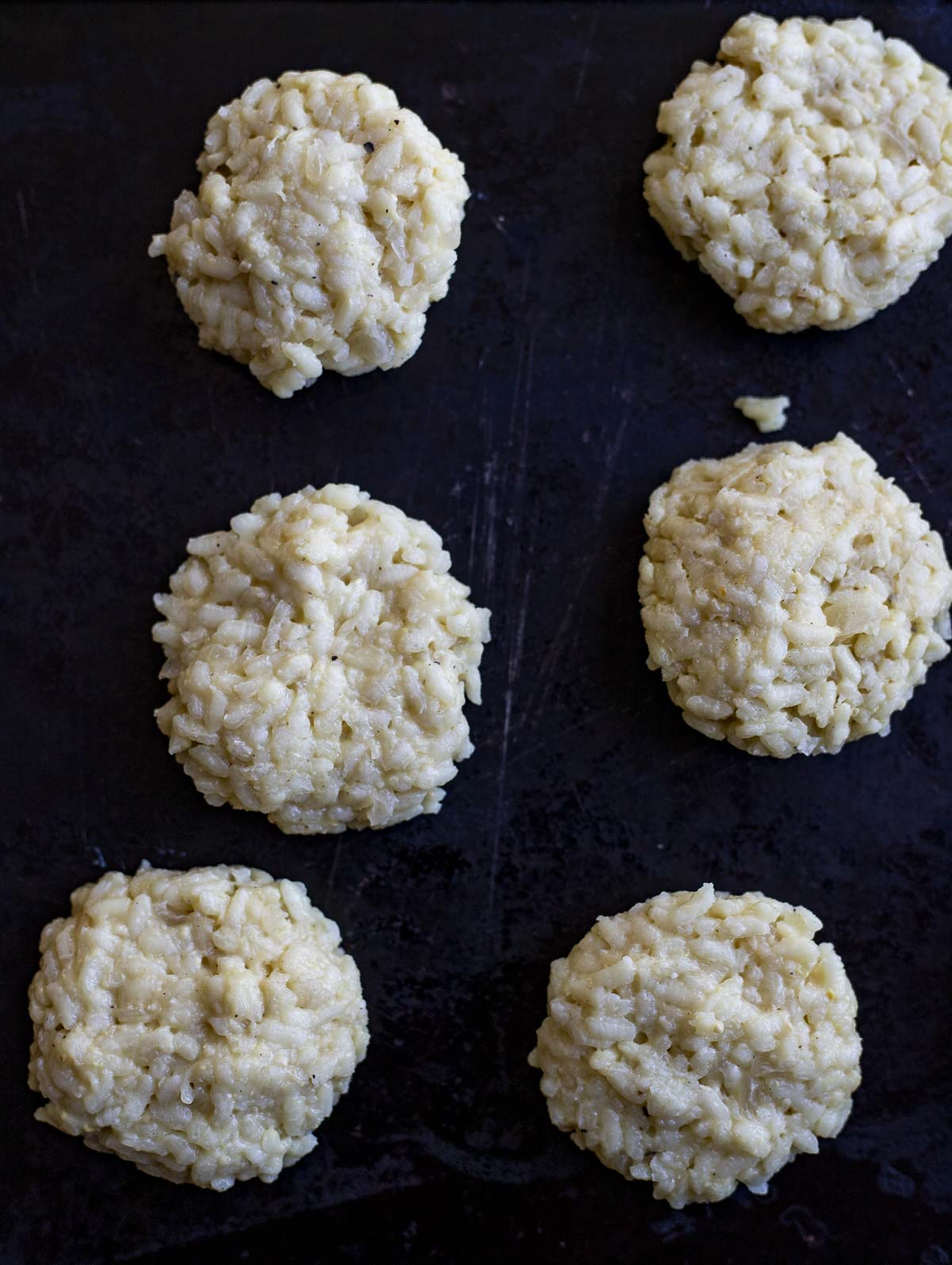 rice cakes flattened on a surface.