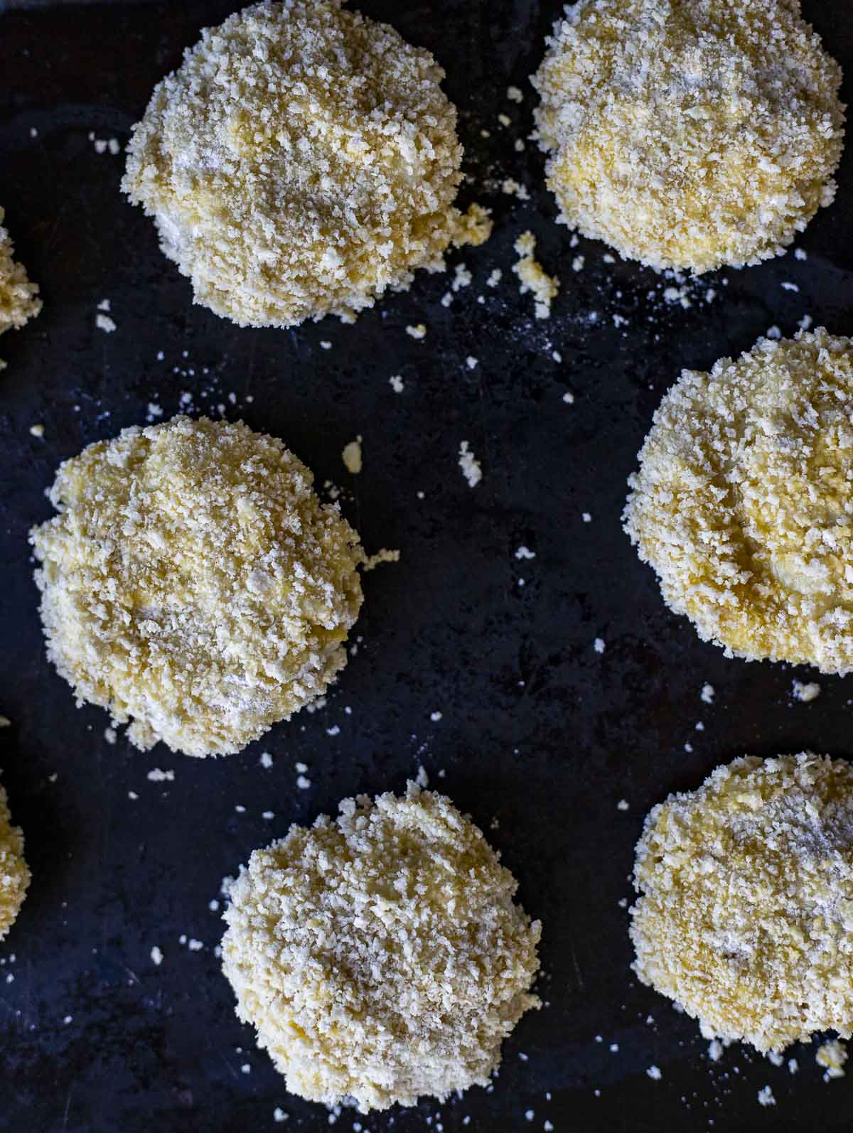 risotto cakes covered in panko bread crumbs.