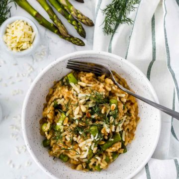 Overhead view of a bowl of risotto with asparagus.