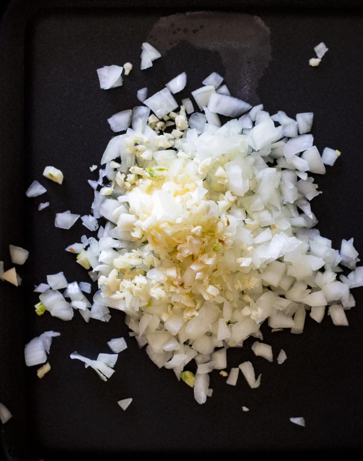 diced onion on a skillet.