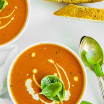 Overhead view of two bowls of tomato soup made with the pressure cooker.