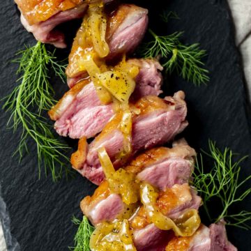 Duck breasts with orange glaze on top.