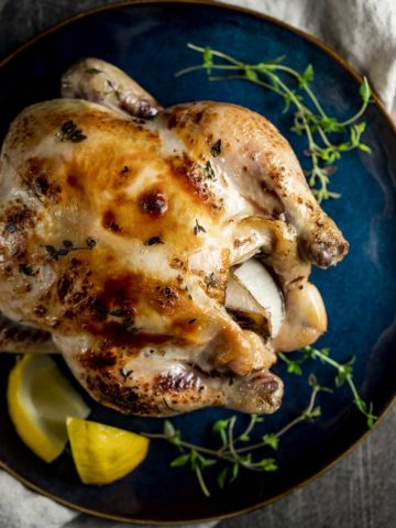 Whole sous vide chicken on a serving plate.