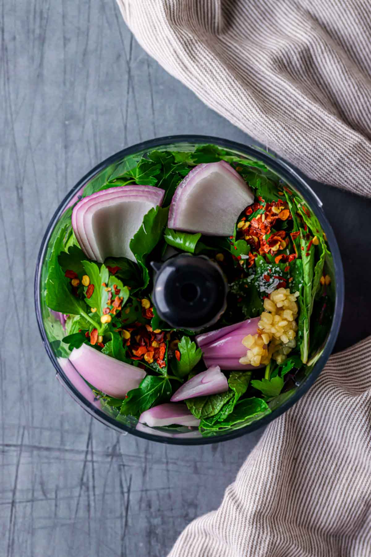 herbs, shallot and spices in a food processor