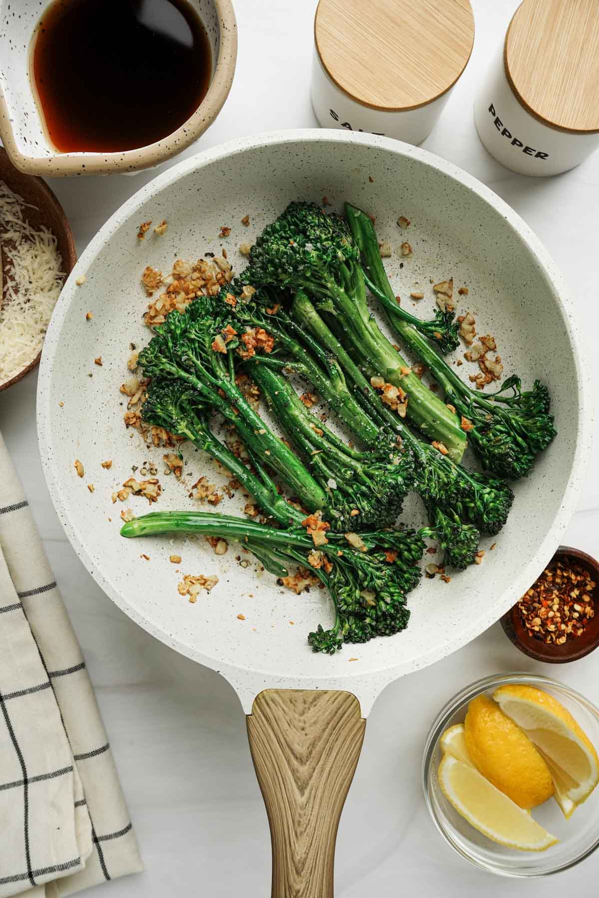 broccoletti in a skillet with toasted garlic