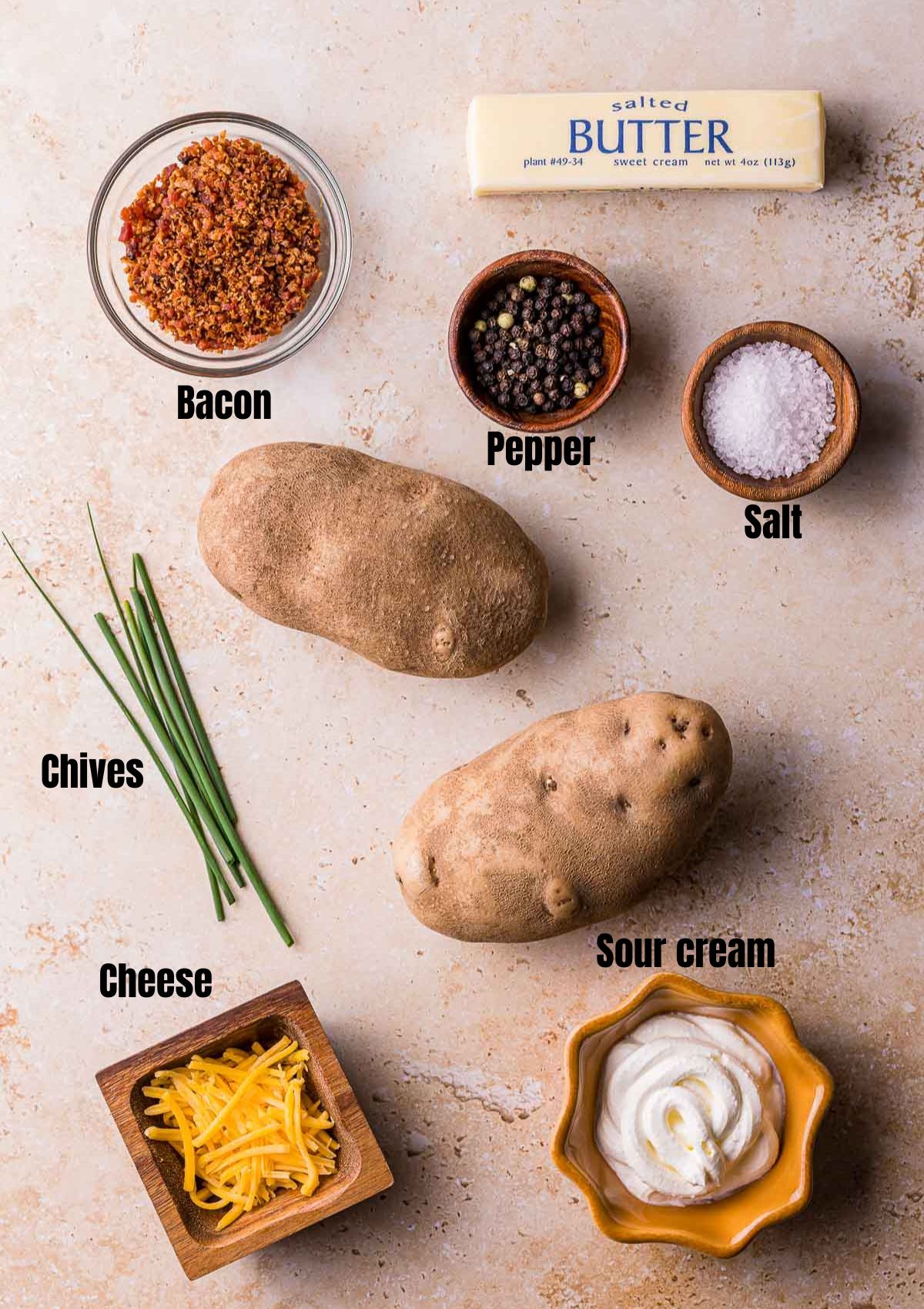 ingredients for sous vide baked potatoes on a brown surface with text