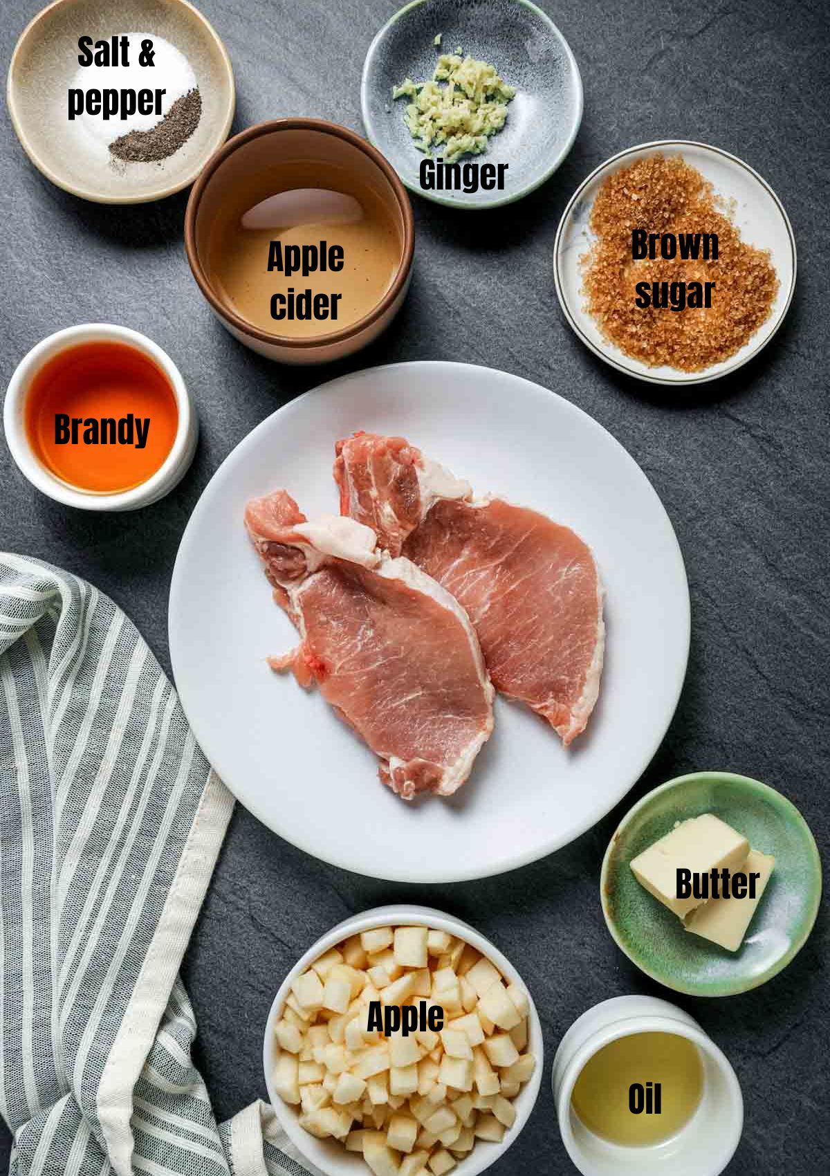 ingredients for sous vide boneless pork chops in bowls in a grey surface with text overlay