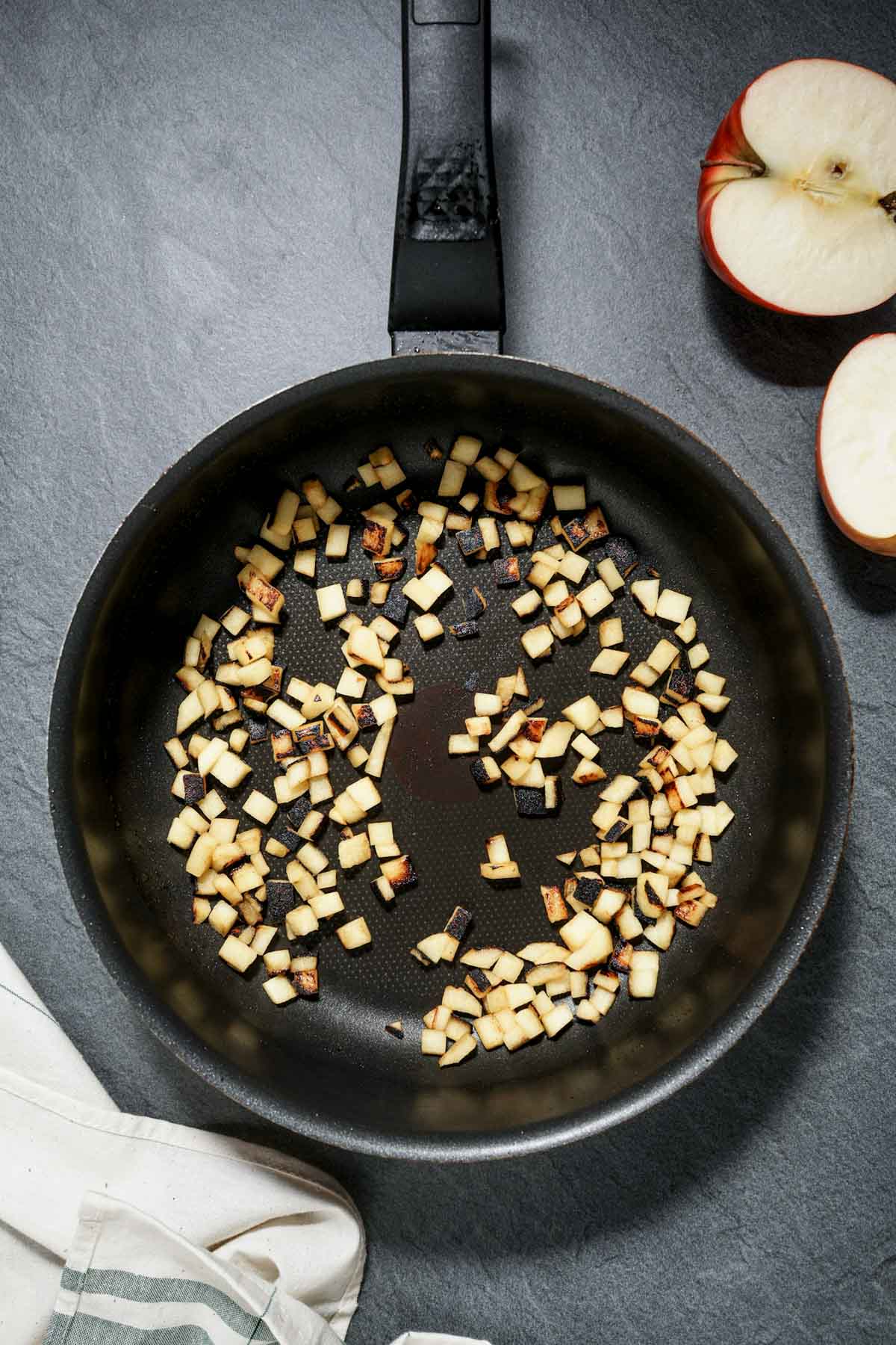 chopped apples begin sauteed in a skillet