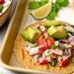 crab ceviche on a tostada with avocado