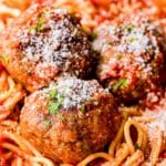 3 meatballs on a pile of spaghetti