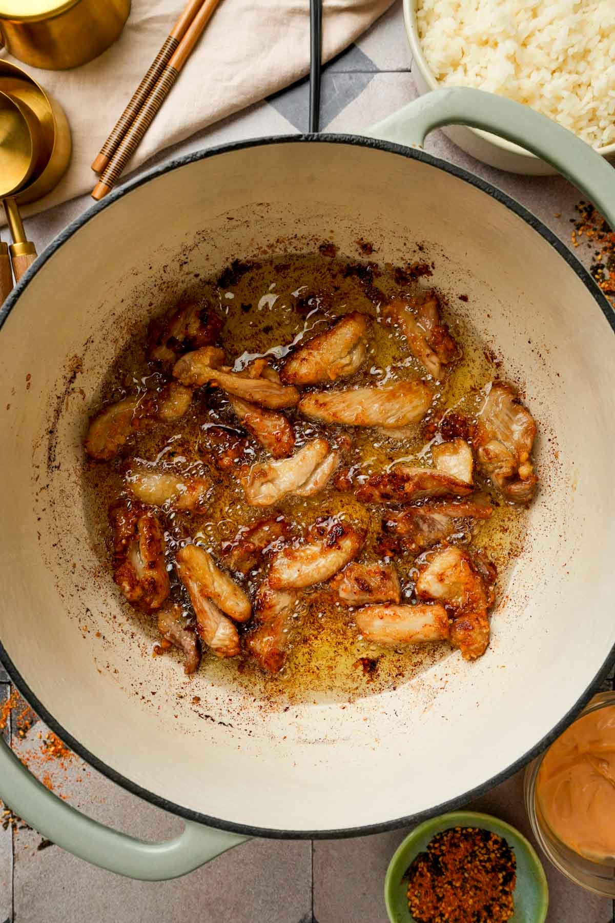 chicken pieces frying in oil to make Japanese fried chicken