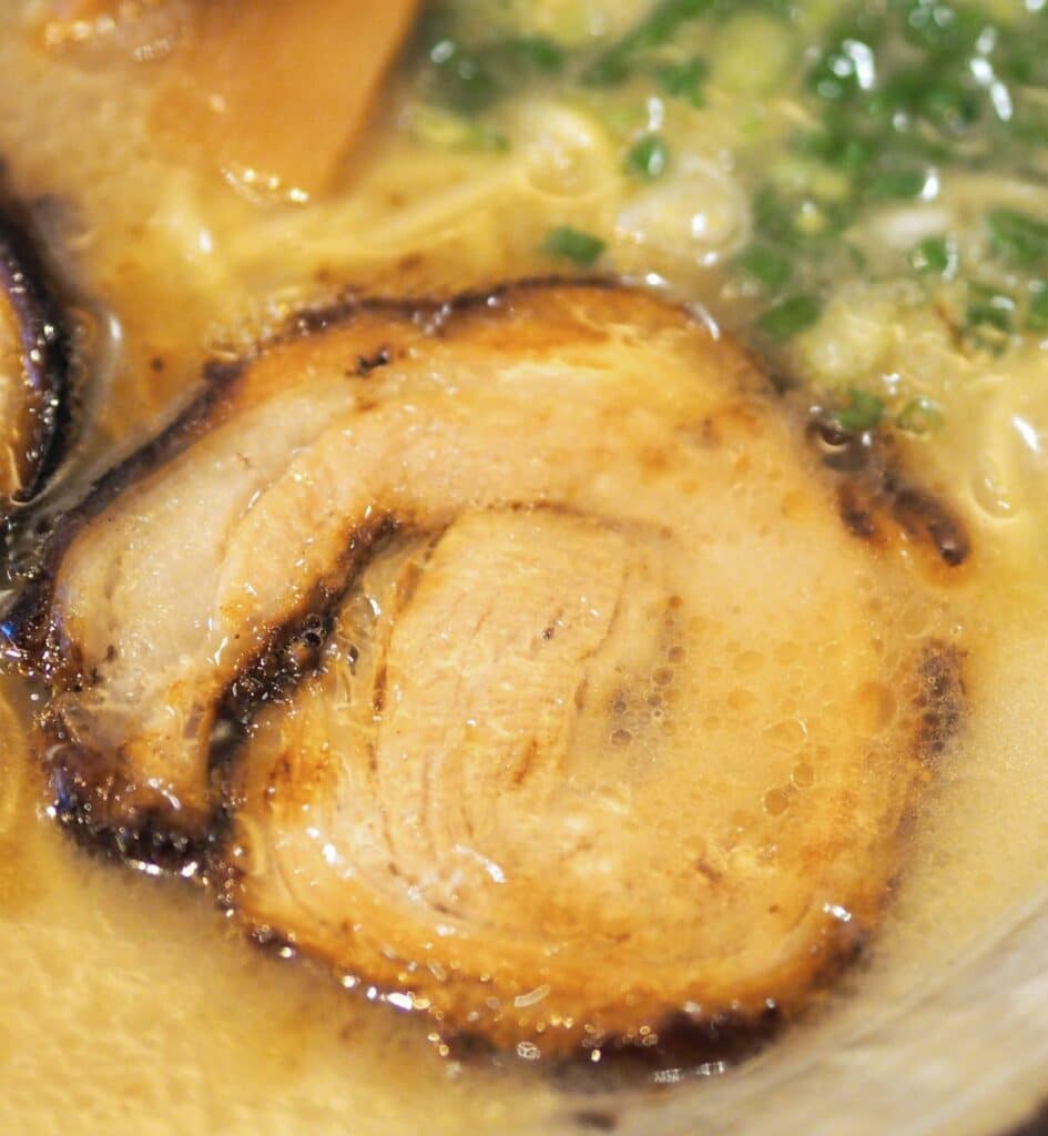 a piece of pork chashu in rboth