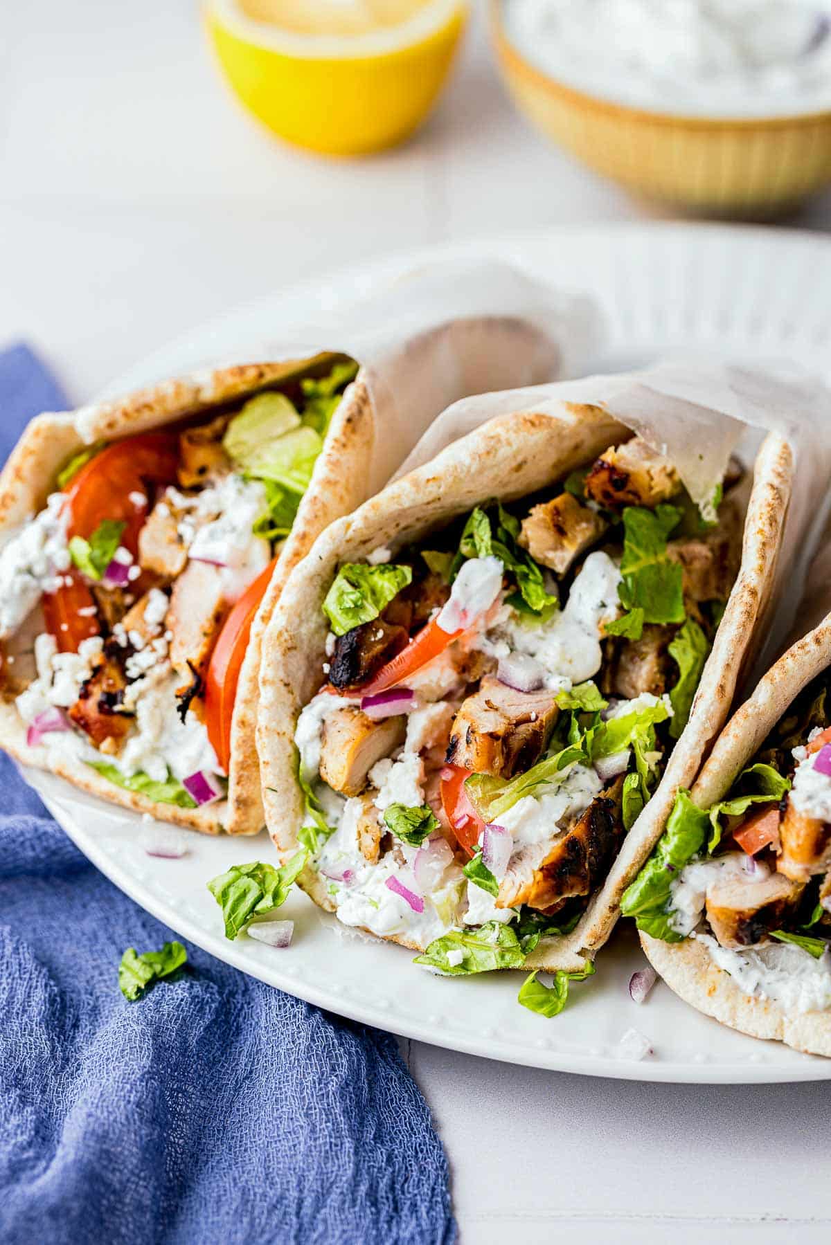 3 chicken gyro pita on a plate