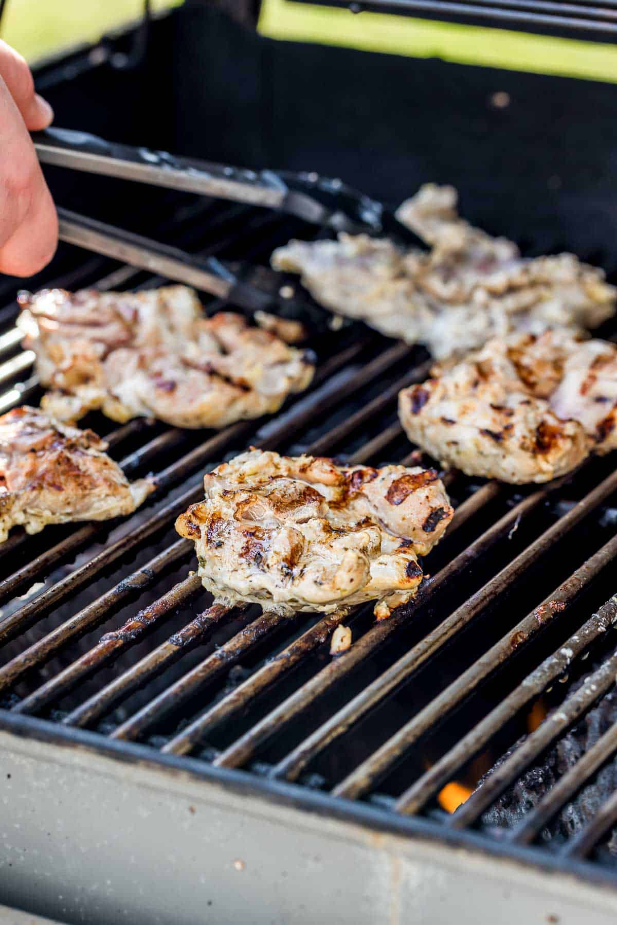 chicken cooking on a grill