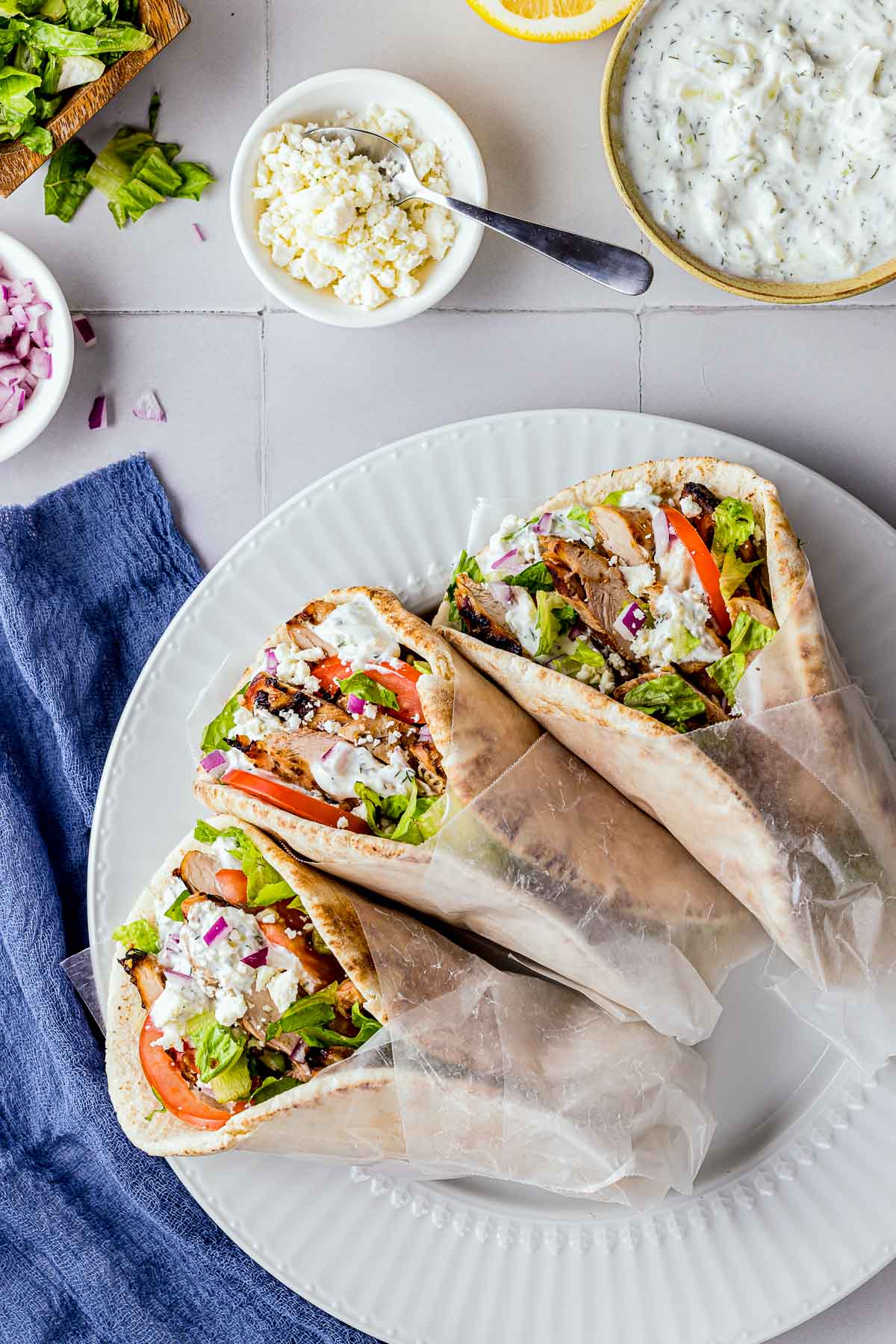 gyros wrapped in pita bread and white paper