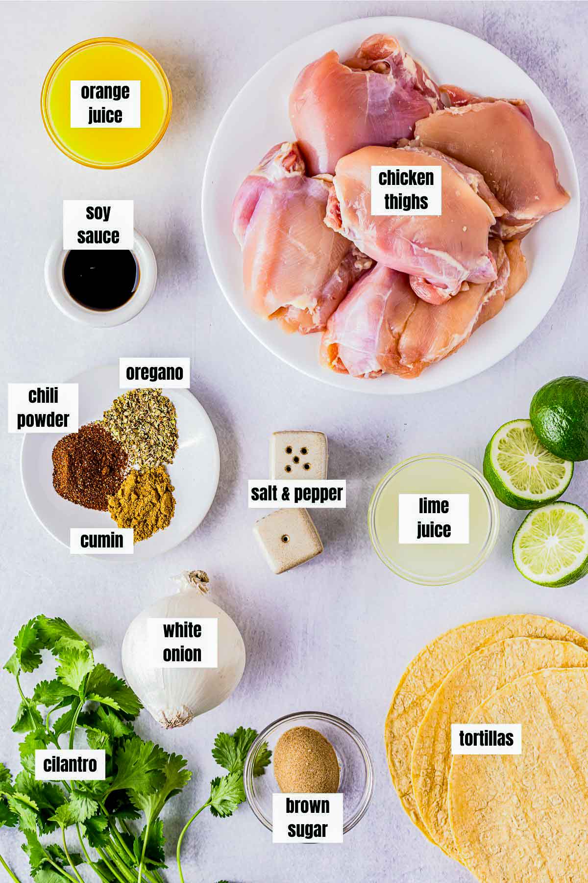 ingredients for tacos de pollo on a white board with labels