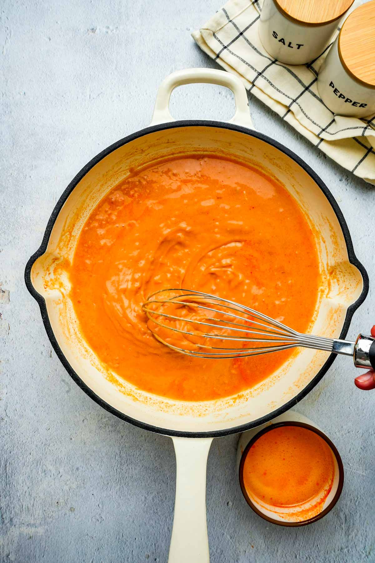 orange colored sauce in a skillet