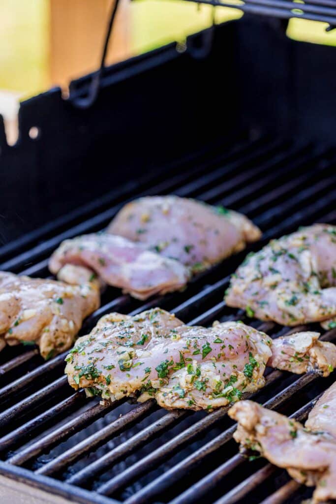 raw chicken on the grill