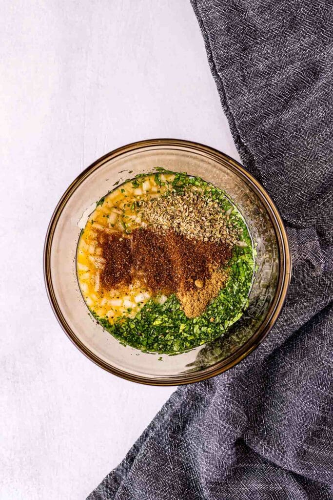 a bowl of seasonings before being mixed