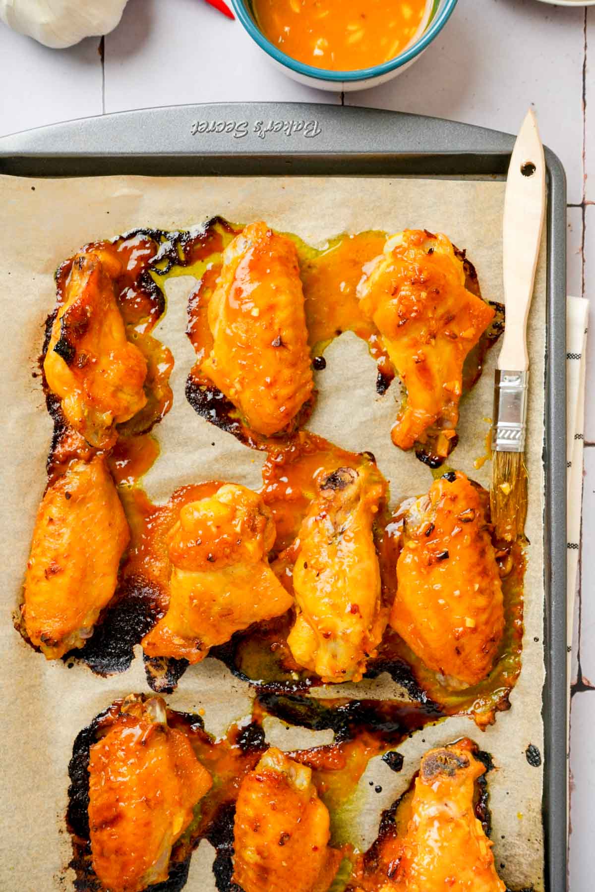 cooked chicken wings on parchment paper