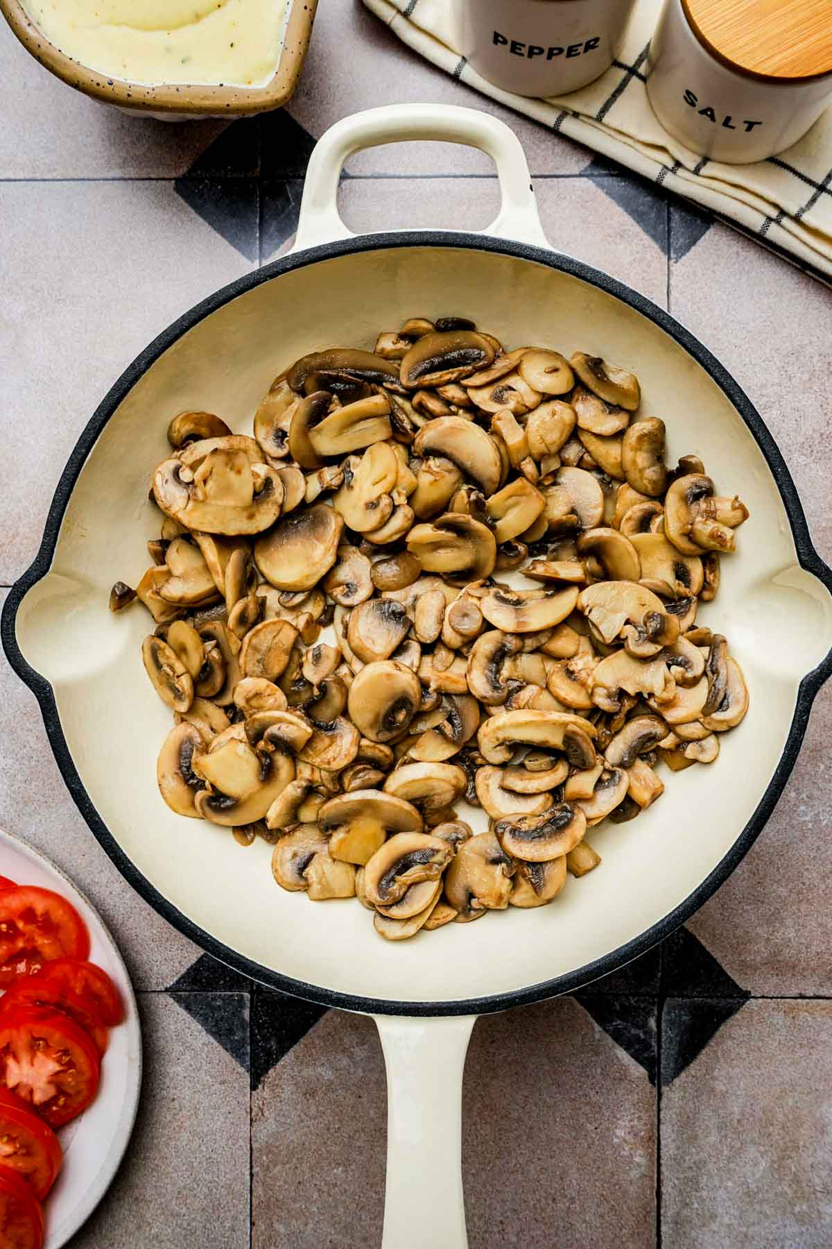 mushrooms cooking in a skillet.