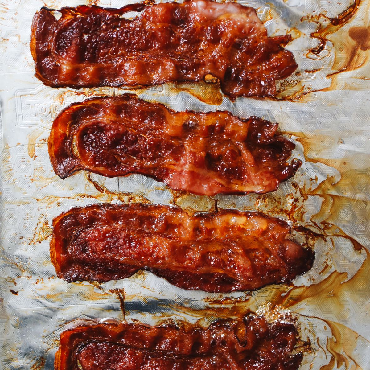 cooked bacon on parchment paper