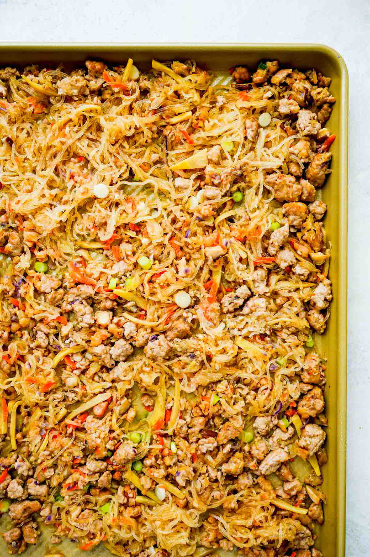 pork and vegetable mixture on a baking sheet.