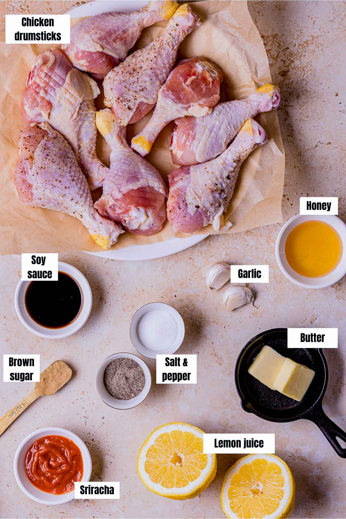 ingredients for sous vide chicken drumsticks on a pink board.