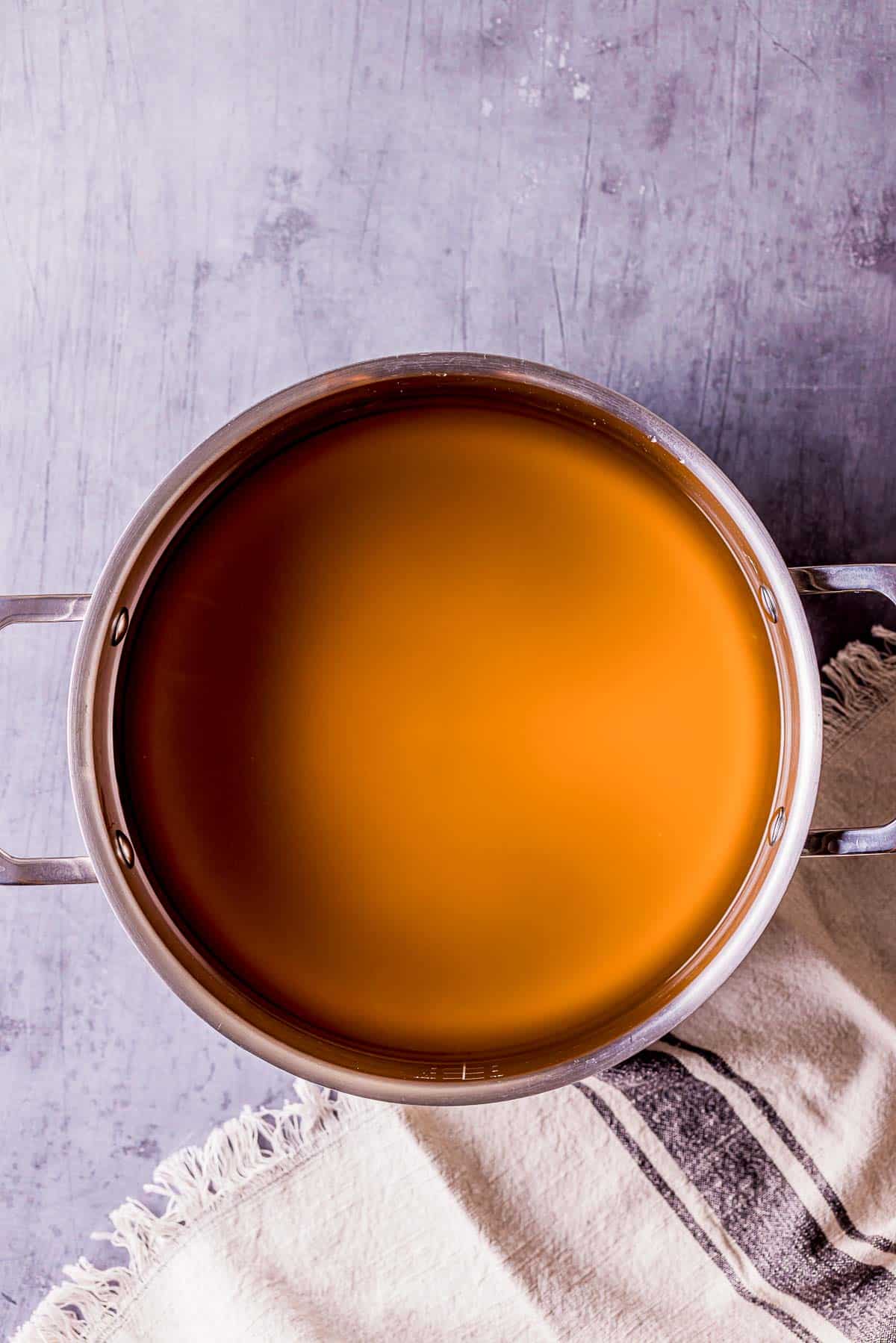 clear broth in a pot.