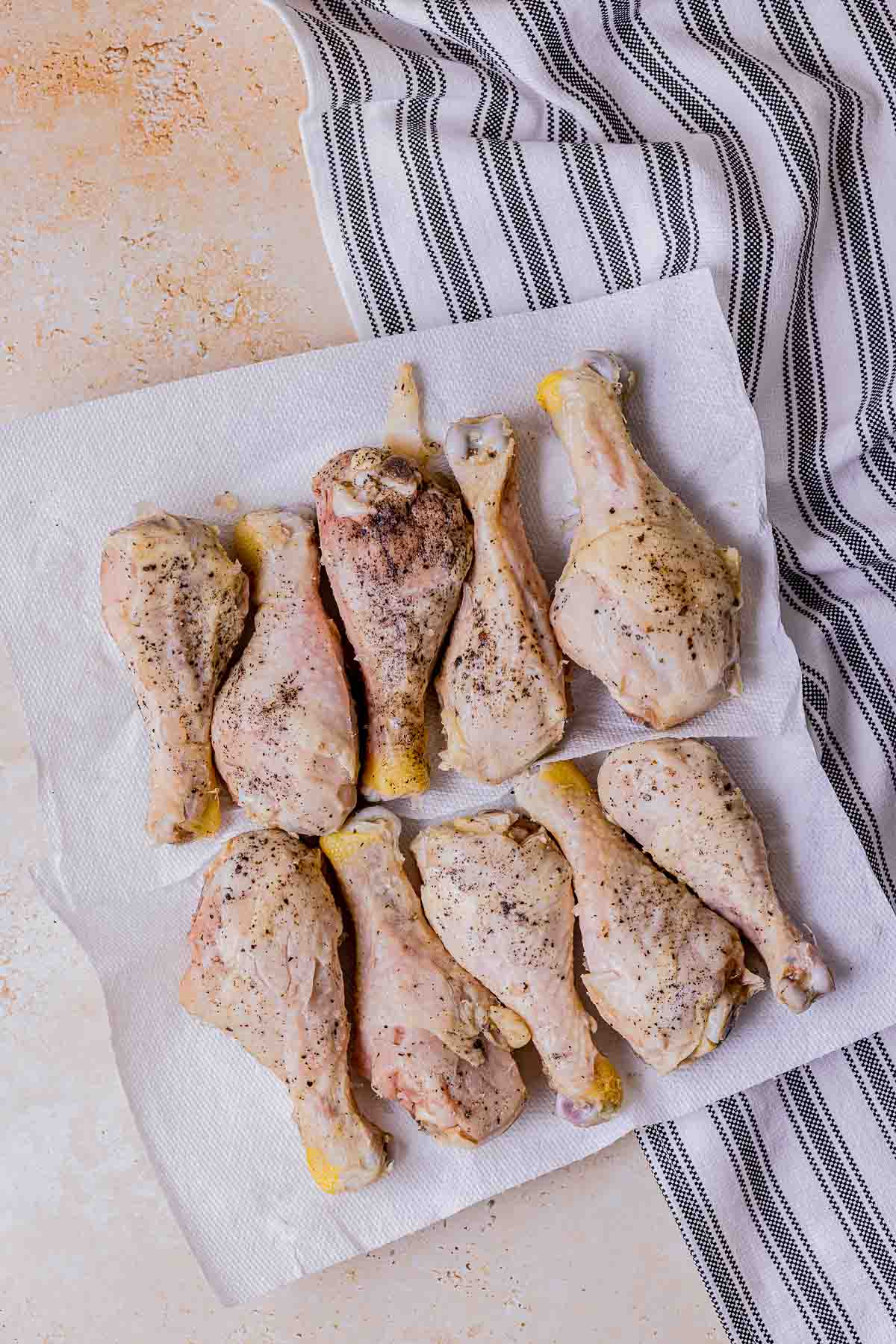 cooked chicken legs on a towel.