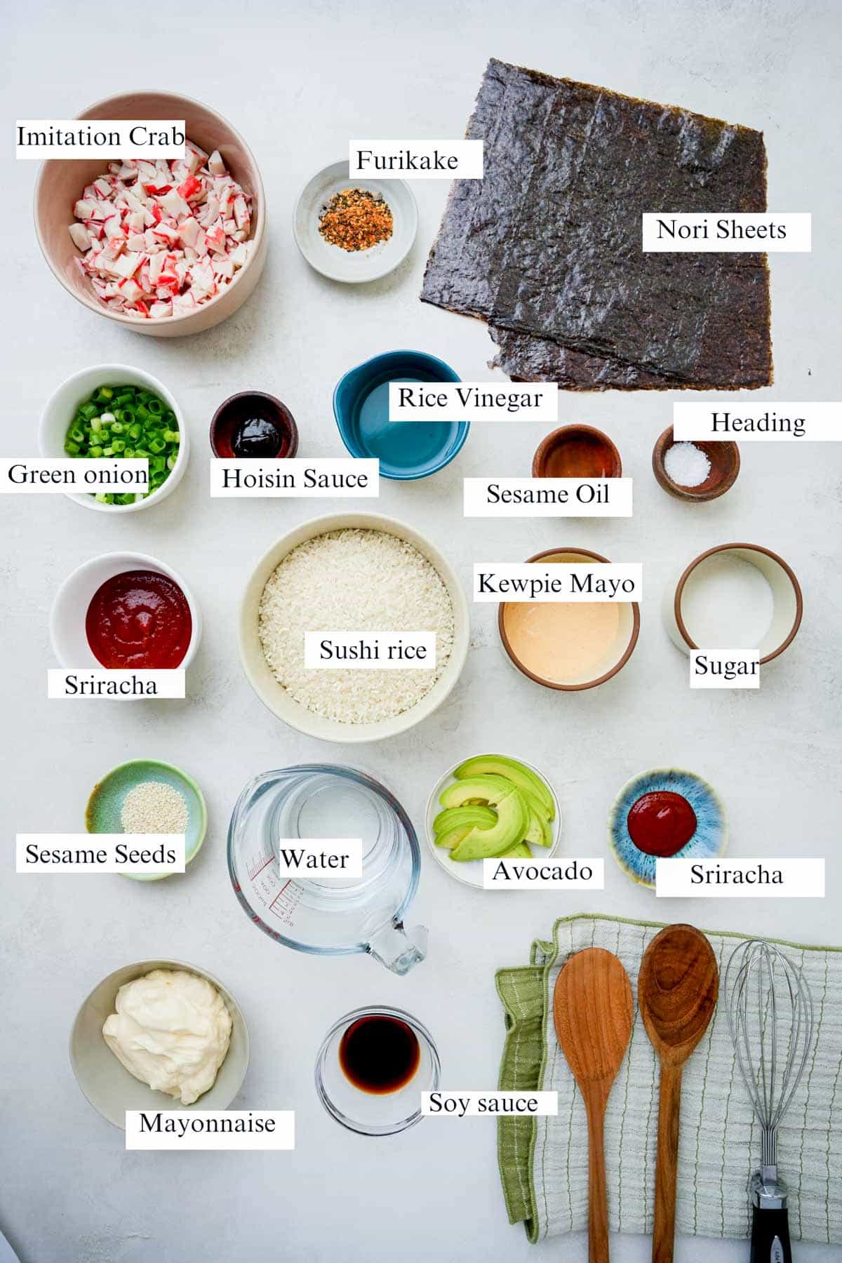 ingredients for sushi crab bake on a white surface with text overlay.