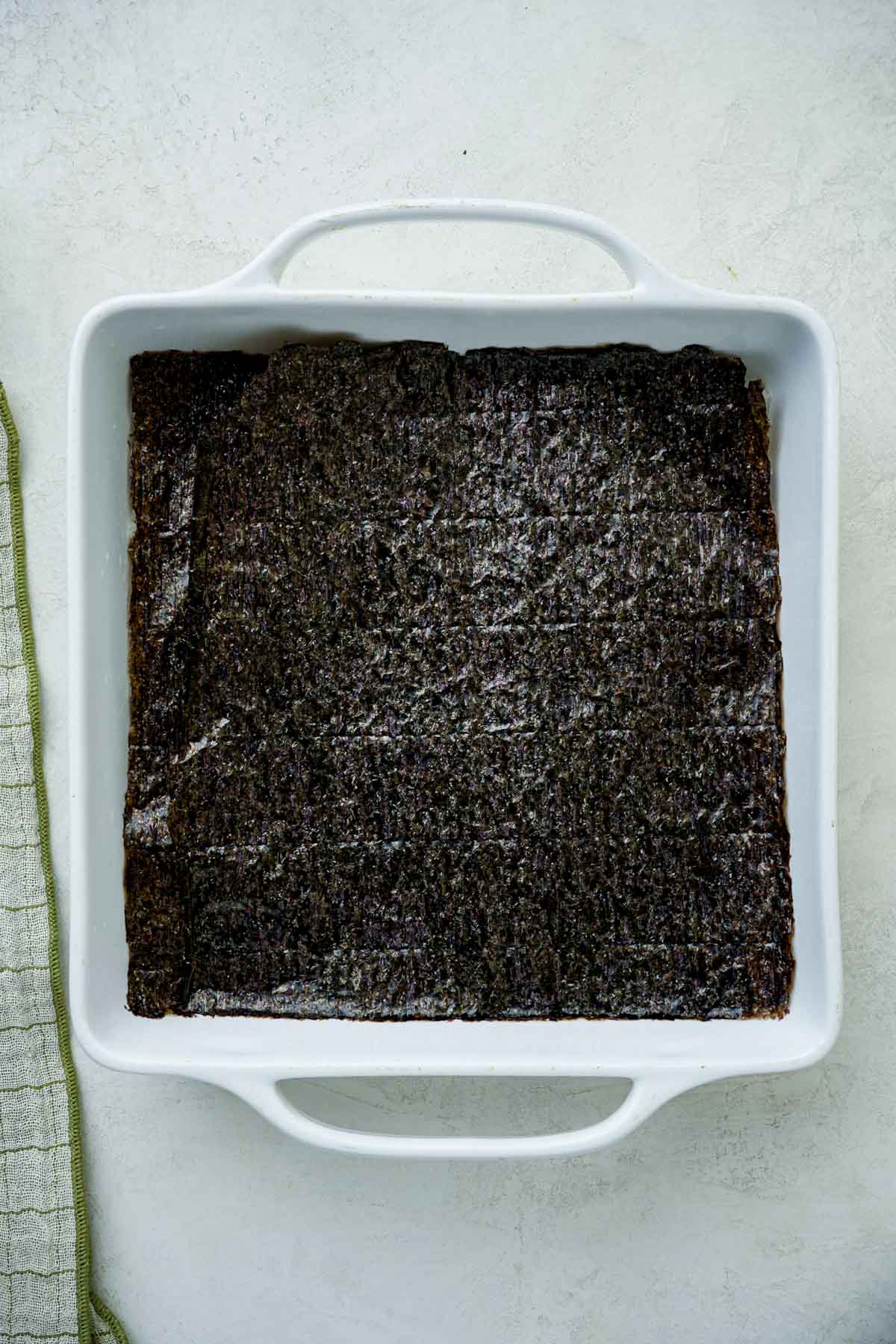 nori sheets pressed into a baking dish.