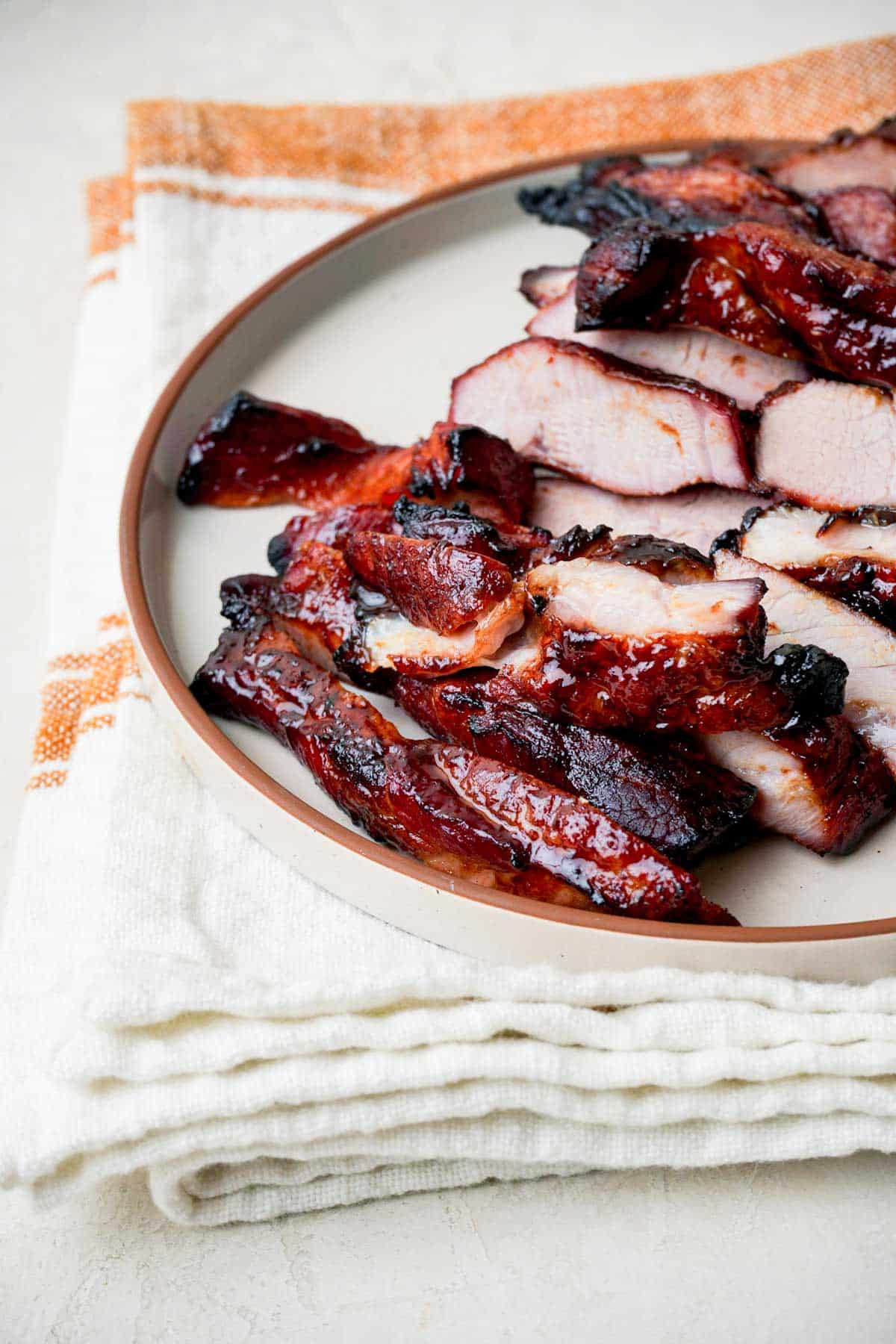 a plate of sliced chinese bbq pork.