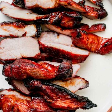 red chinese roast pork on a white plate.