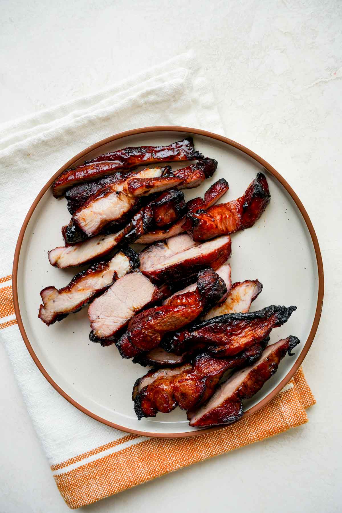 sliced of char sui on a plate.