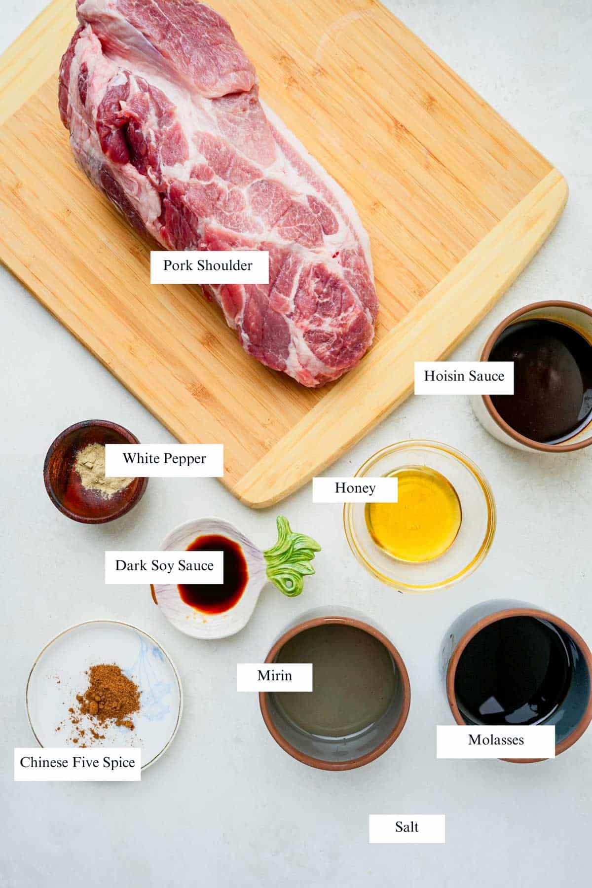 ingredients for chinese roast pork on a board with labels.