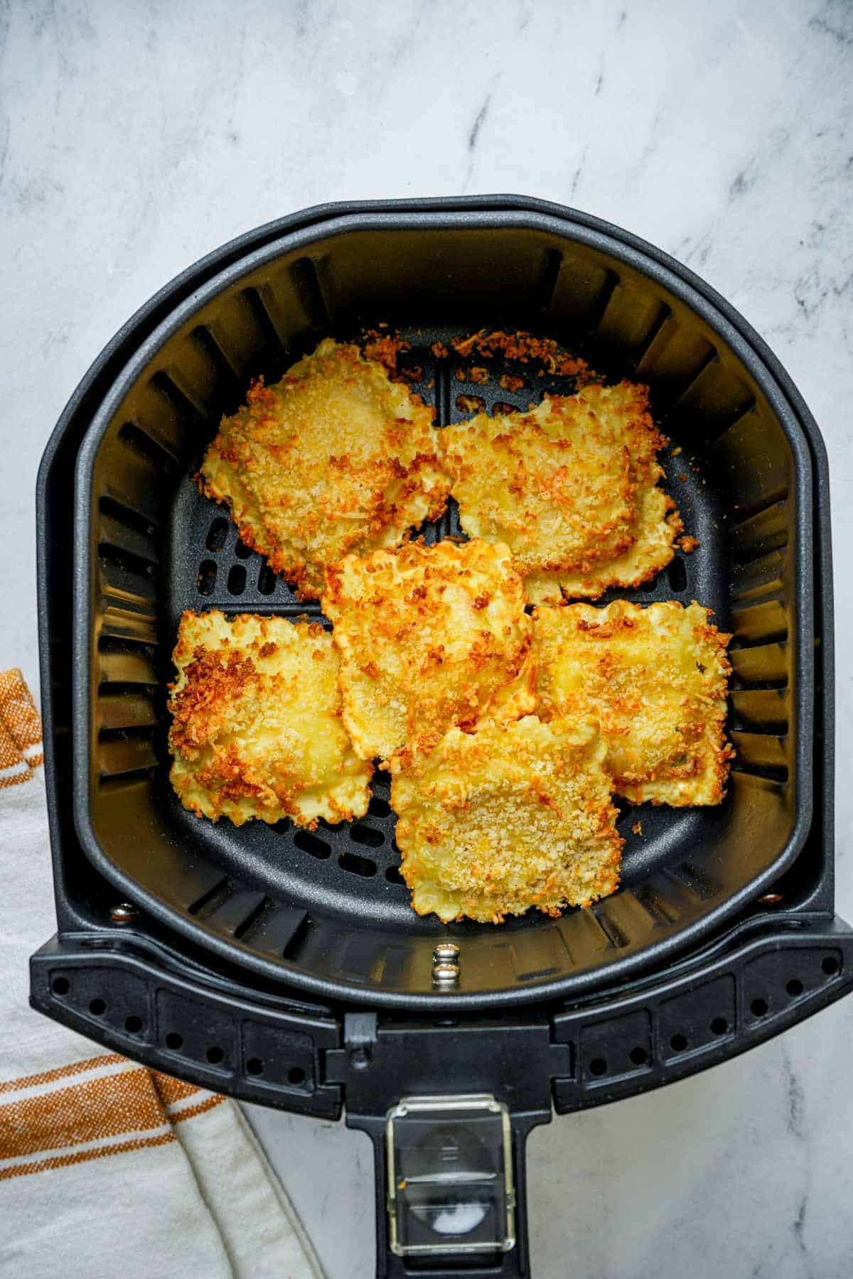 toasted ravioli in an air fryer.