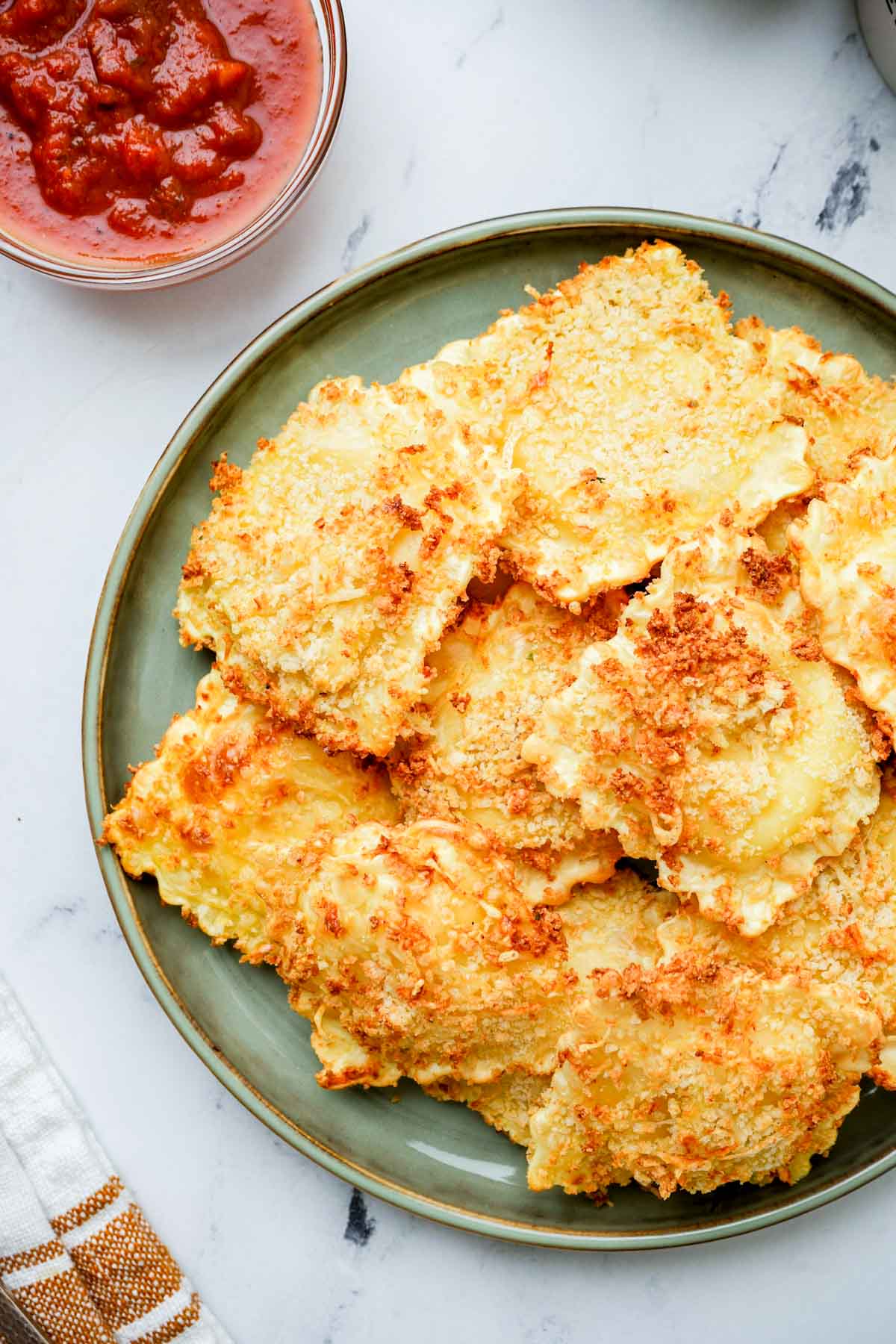 toasted air fryer ravioli on a plate. 