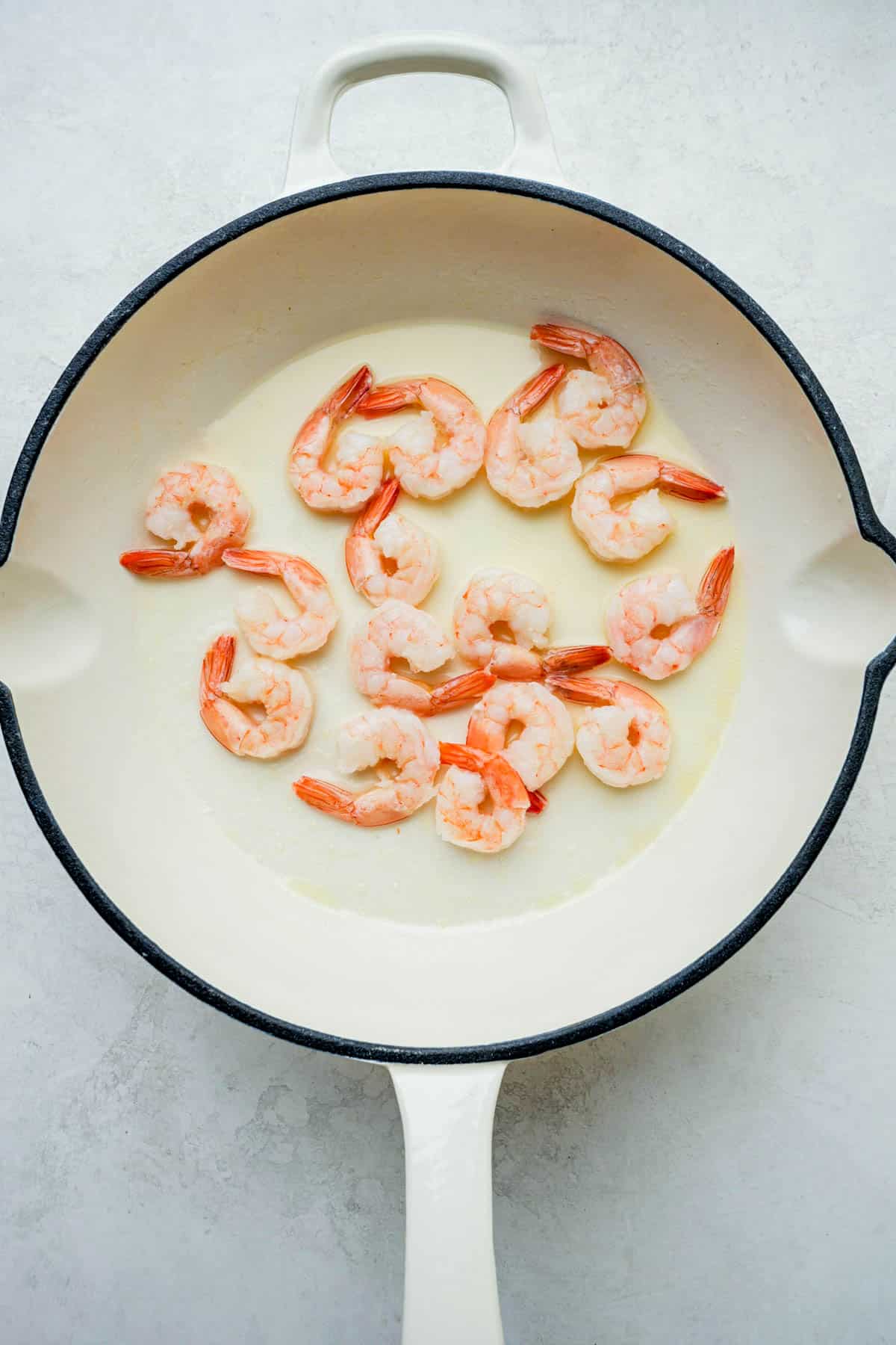 shrimp cooking in a skillet.