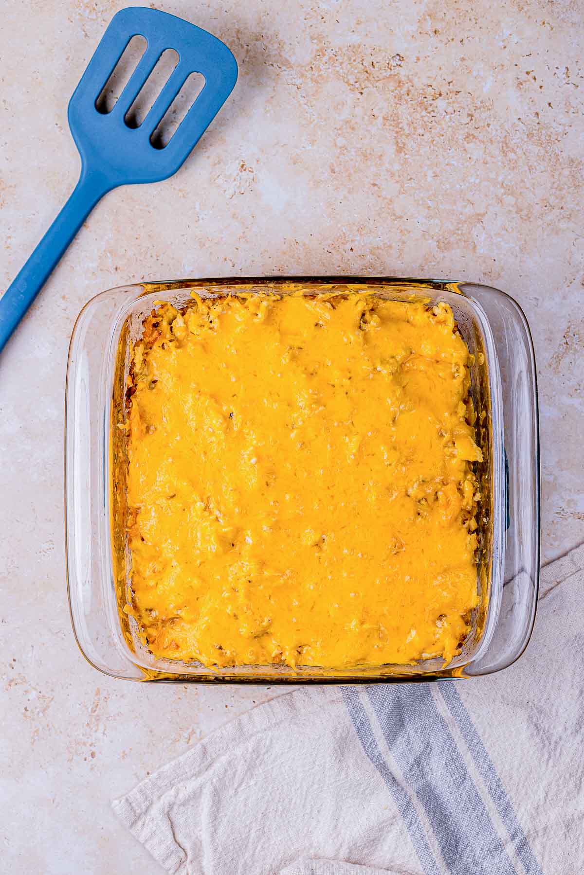 baked cuban casserole topped with melted cheddar cheese.