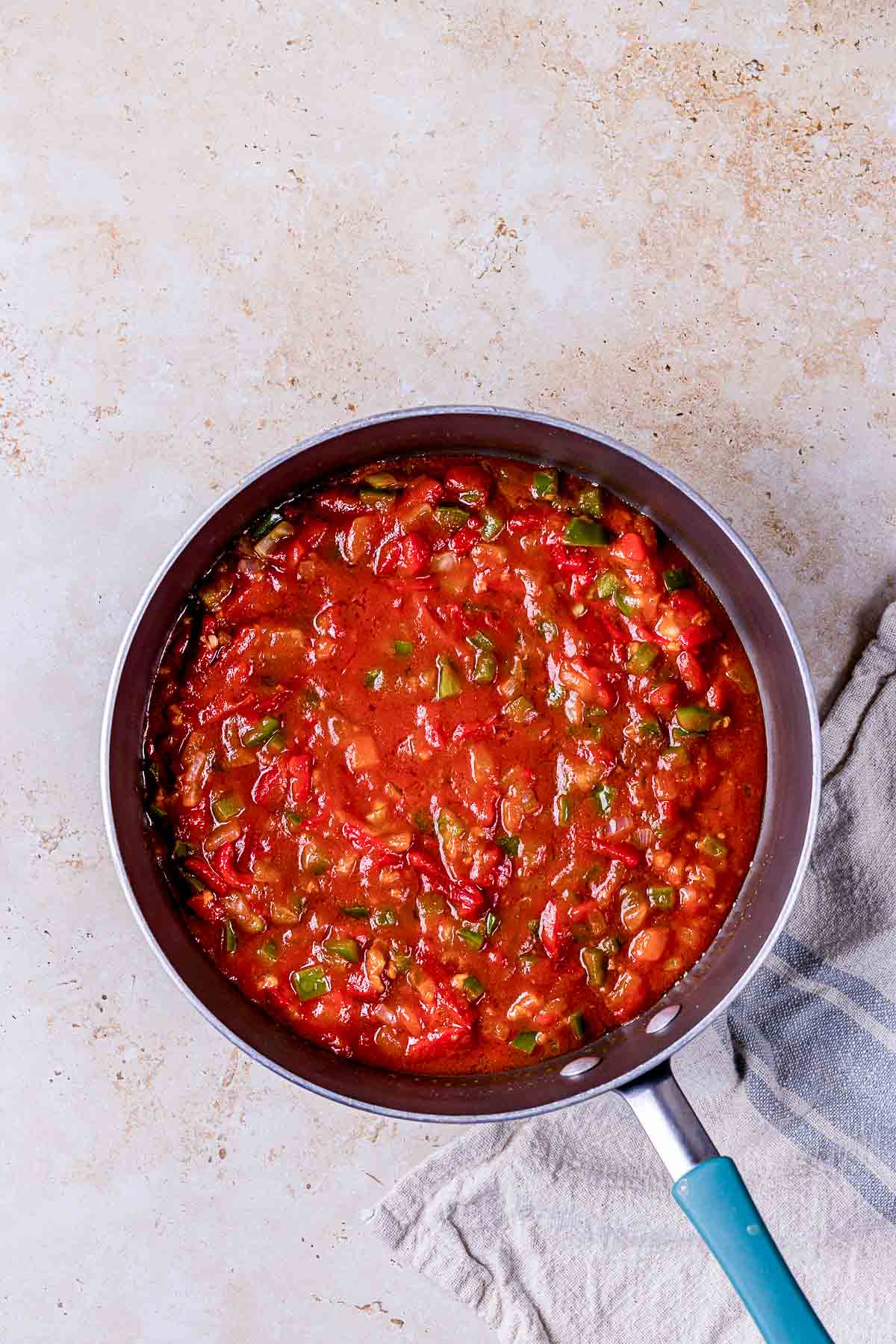 red tomato sauce cooking in a skillet.