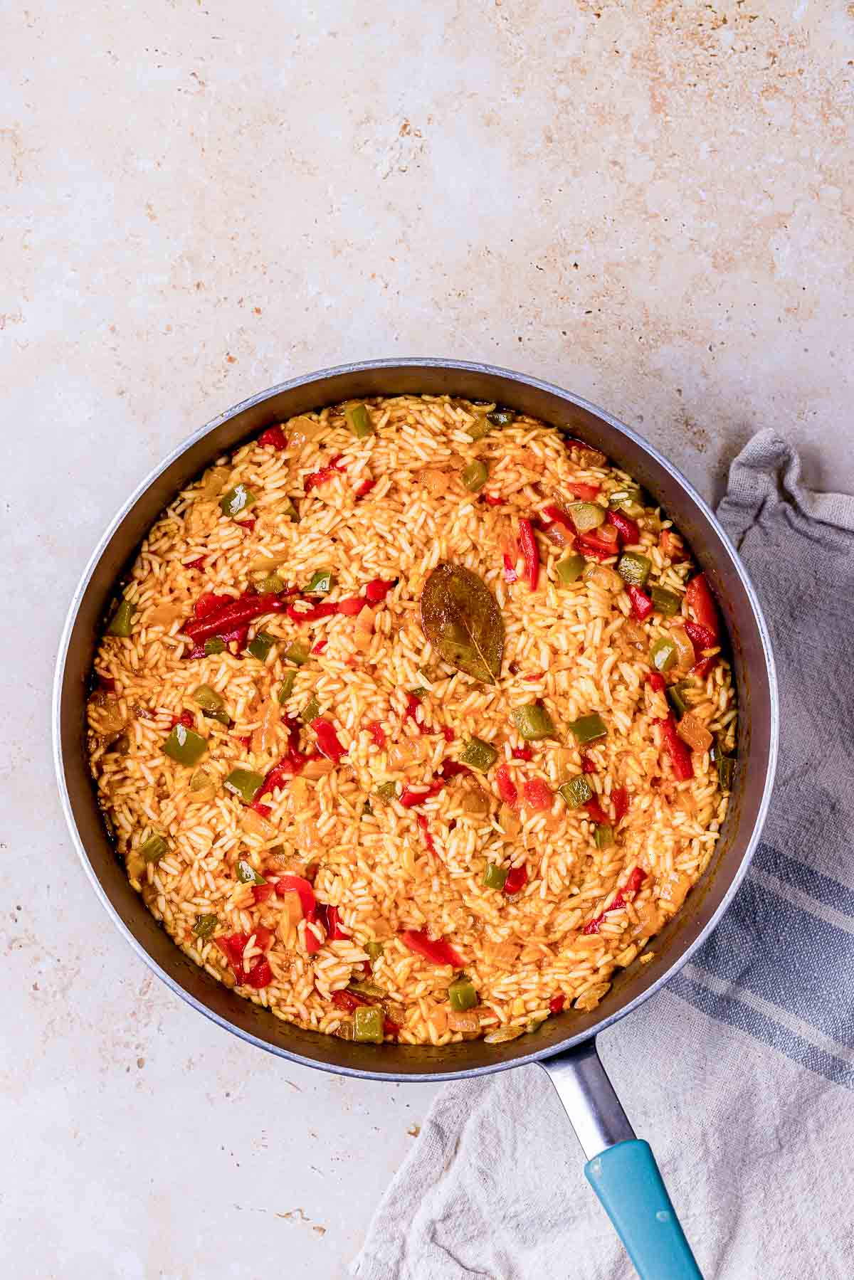 rice and vegetables cooked in a skillet.