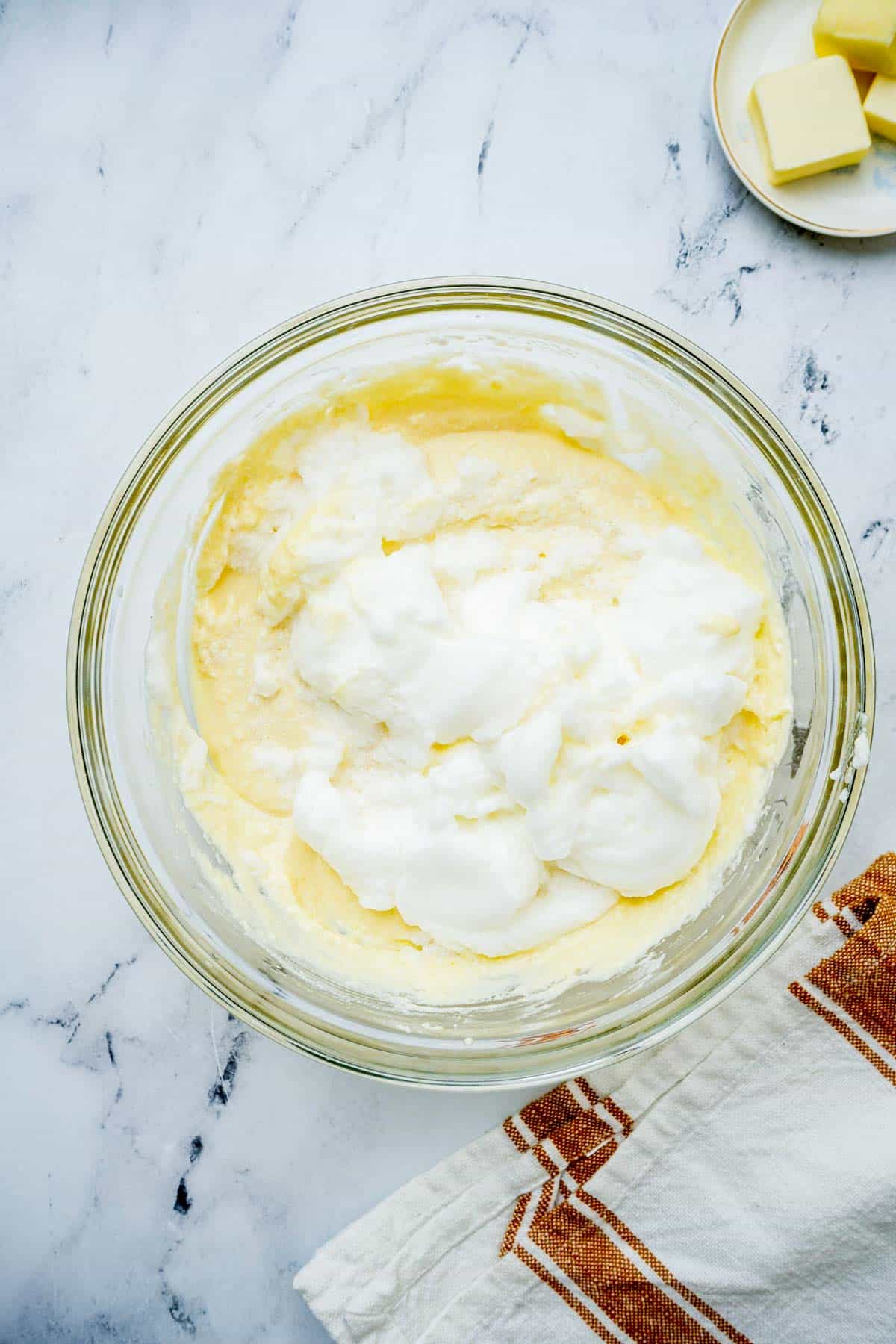 egg whites being mixed into batter.